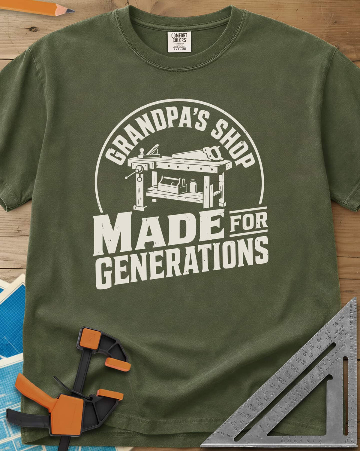 Grandpa'S Shop heavyweight tee in Hemp, arched title over a workbench with a plane, handsaw and toolbox