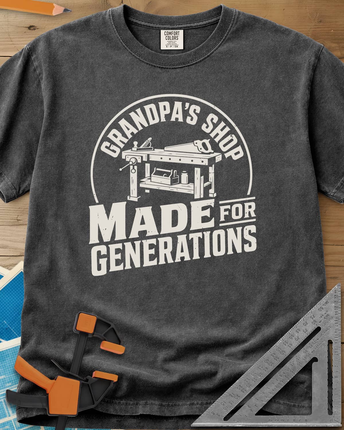 Grandpa'S Shop heavyweight tee in Pepper, arched title over a workbench with a plane, handsaw and toolbox