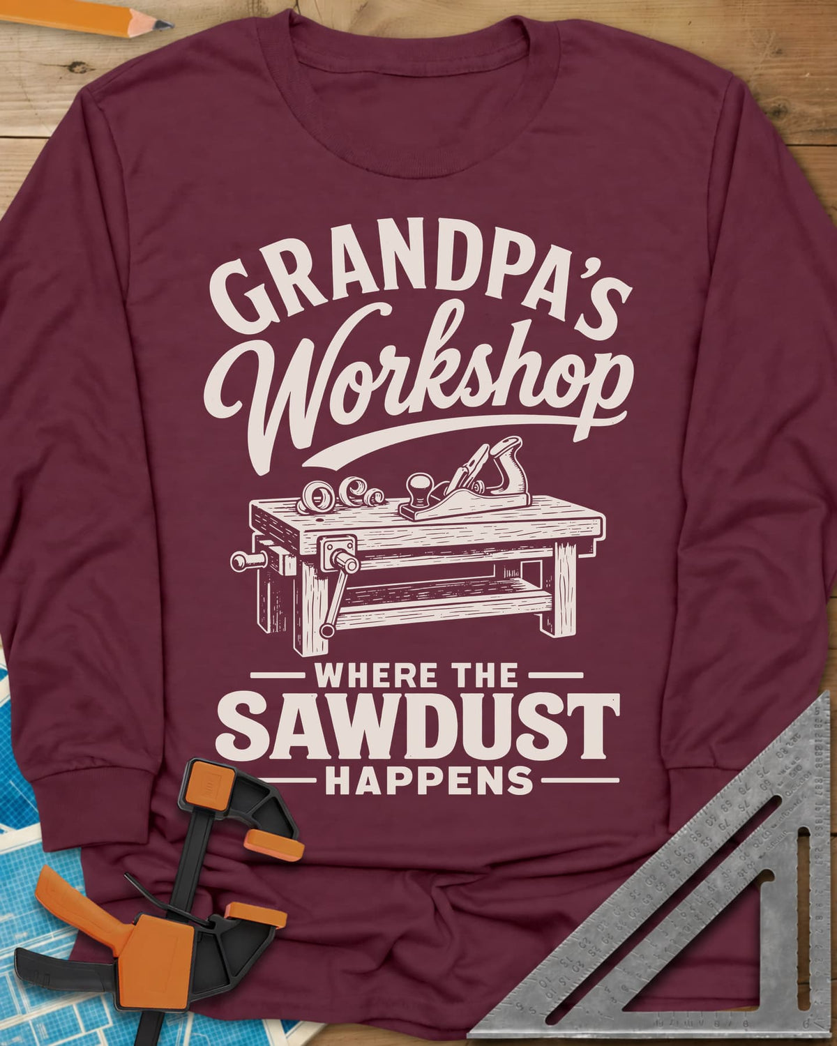 Grandpa'S Workshop long sleeve shirt in Maroon, script lettering over a workbench with a hand plane and shavings