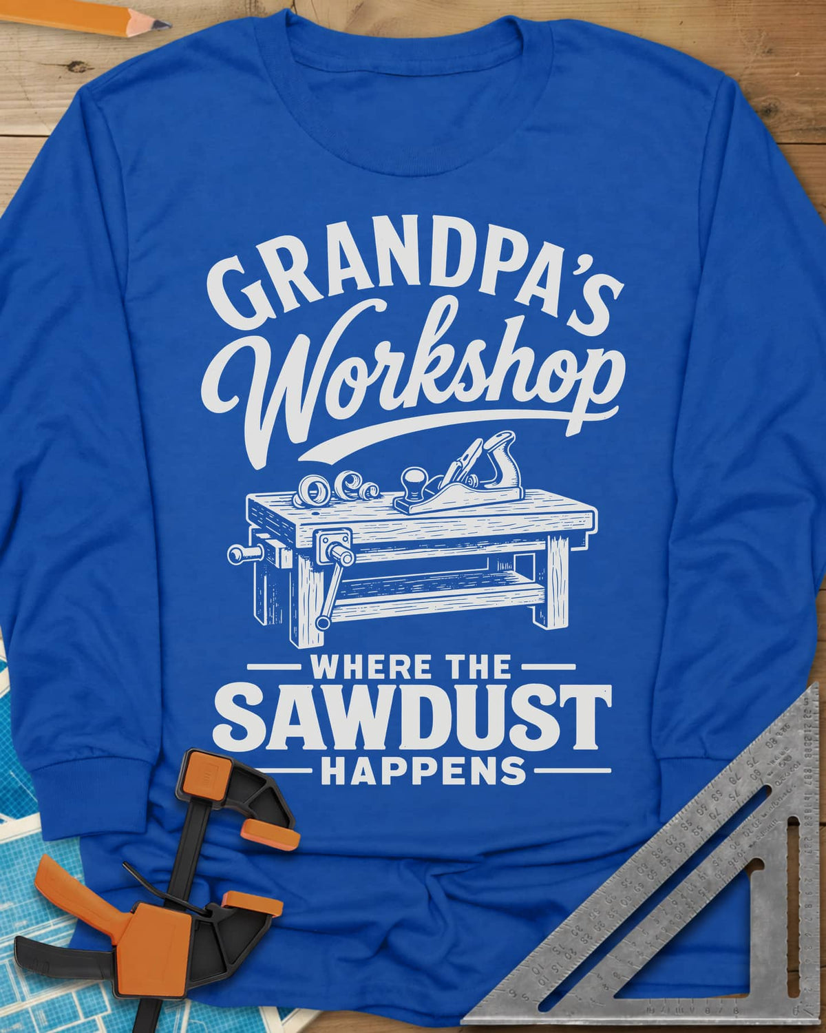 Grandpa'S Workshop long sleeve shirt in Royal, script lettering over a workbench with a hand plane and shavings