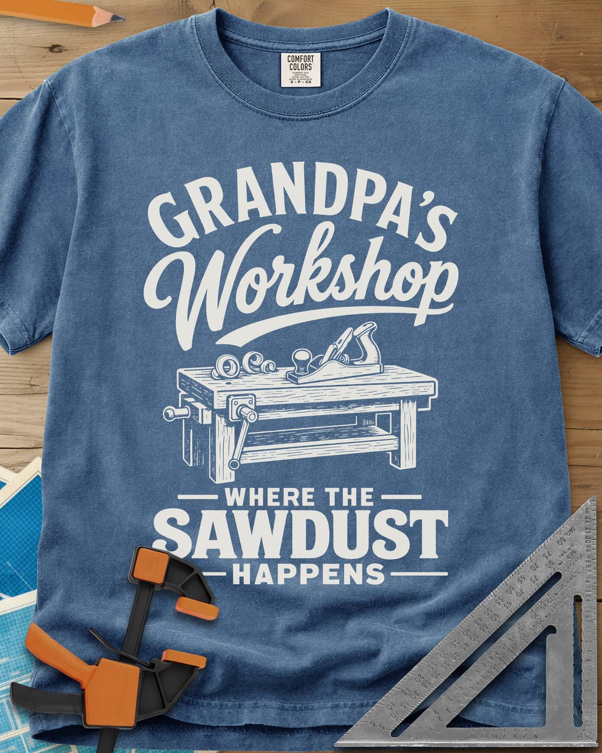 Grandpa'S Workshop heavyweight tee in Blue Jean, script lettering over a workbench with a hand plane and shavings