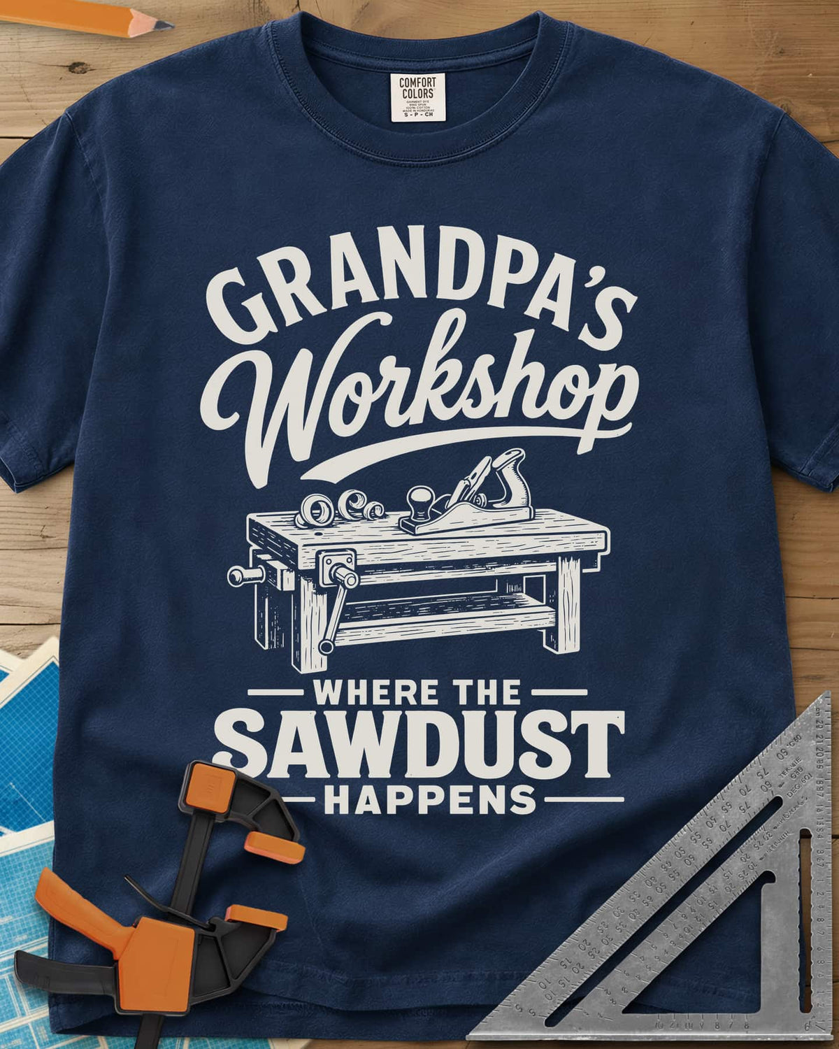 Grandpa'S Workshop heavyweight tee in Navy, script lettering over a workbench with a hand plane and shavings