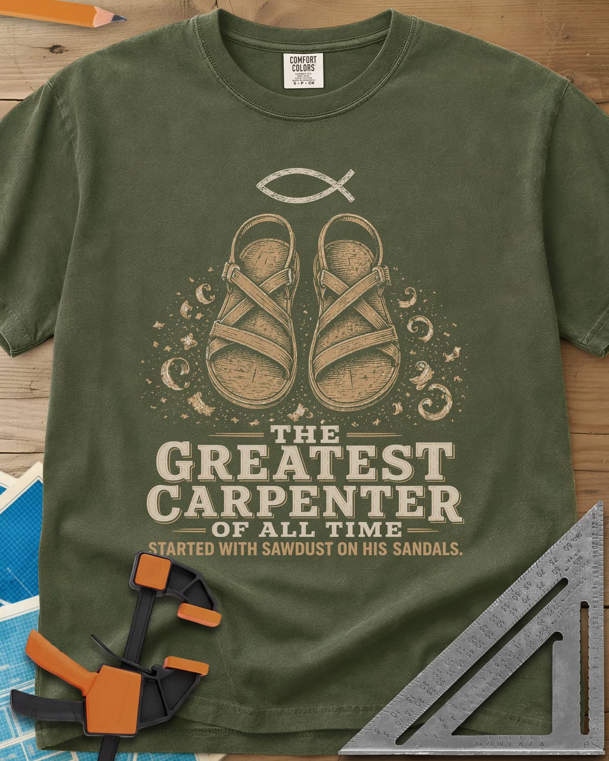 Greatest Carpenter heavyweight tee in Hemp, fish symbol over sandals dusted with wood shavings