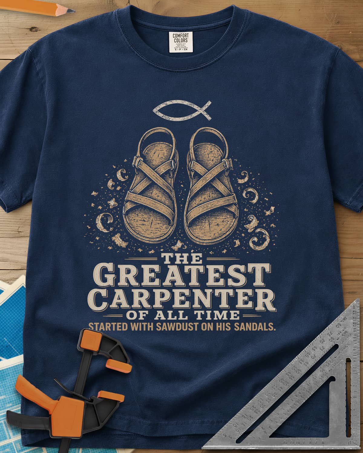 Greatest Carpenter heavyweight tee in Navy, fish symbol over sandals dusted with wood shavings