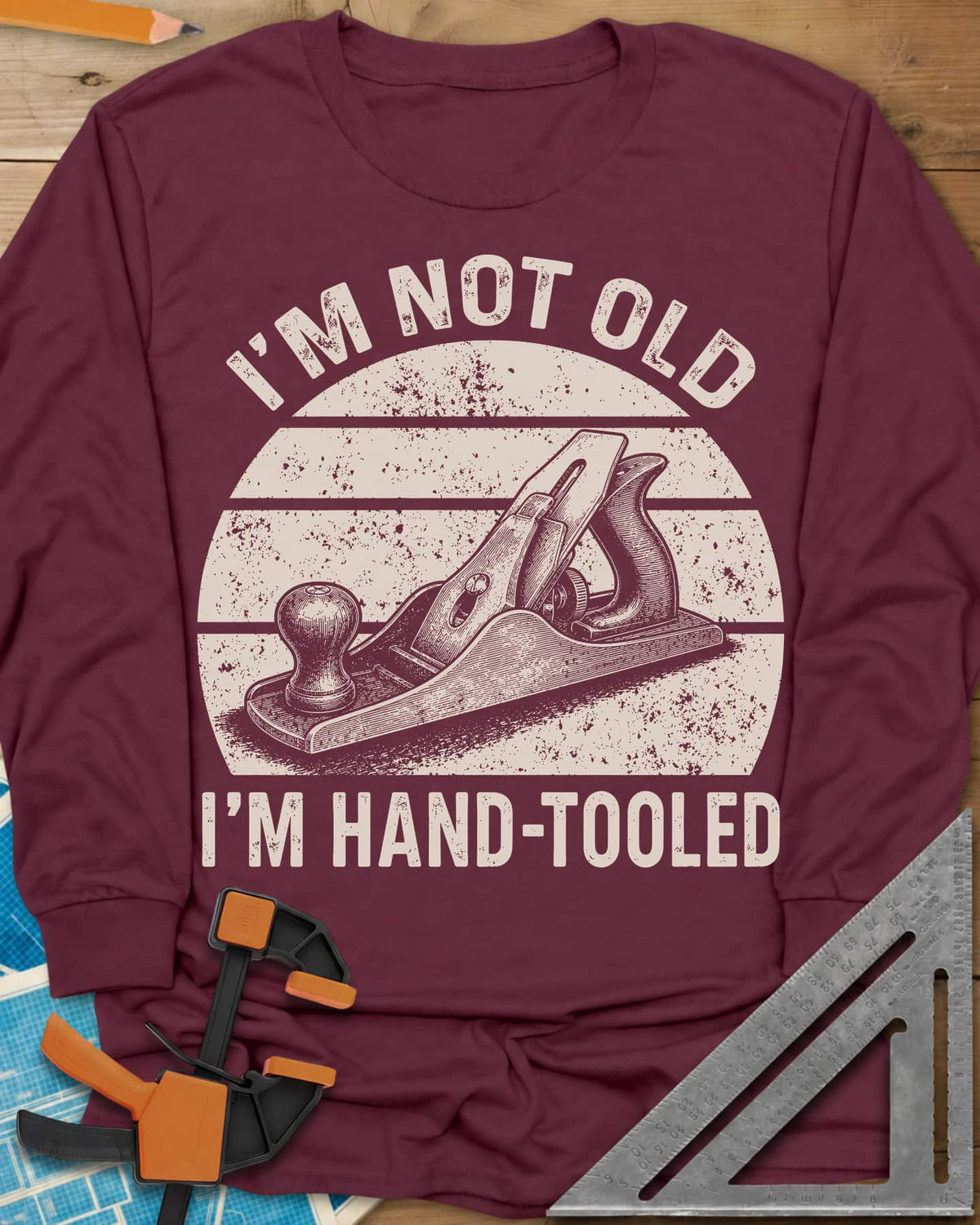 Hand Tooled long sleeve shirt in Maroon, a bench plane in a retro sunset circle