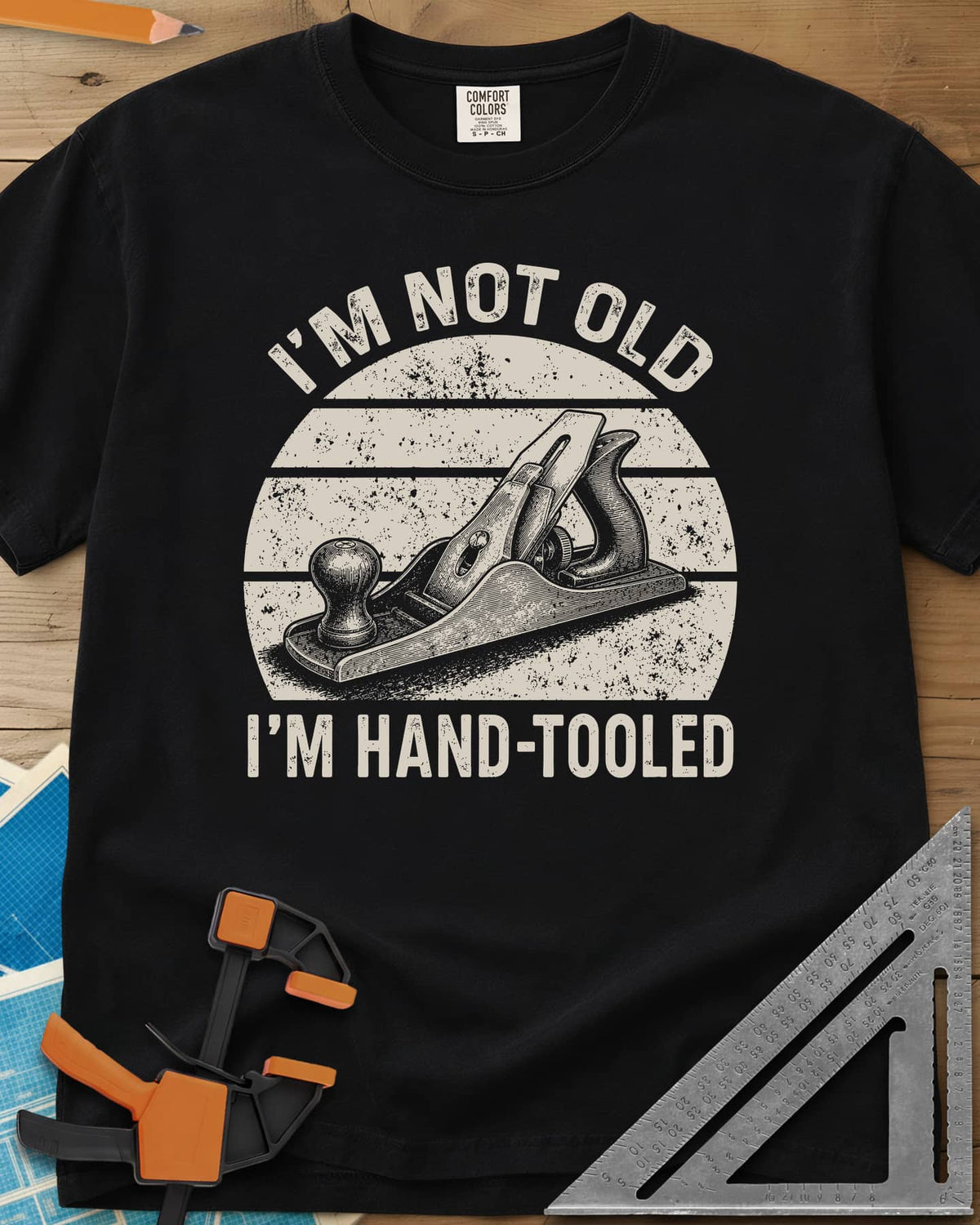 Hand Tooled heavyweight tee in Black, a bench plane in a retro sunset circle