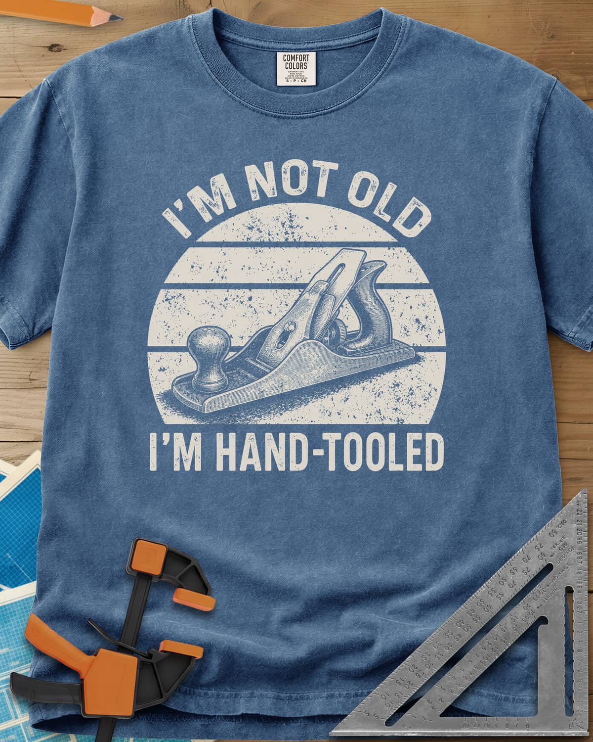 Hand Tooled heavyweight tee in Blue Jean, a bench plane in a retro sunset circle