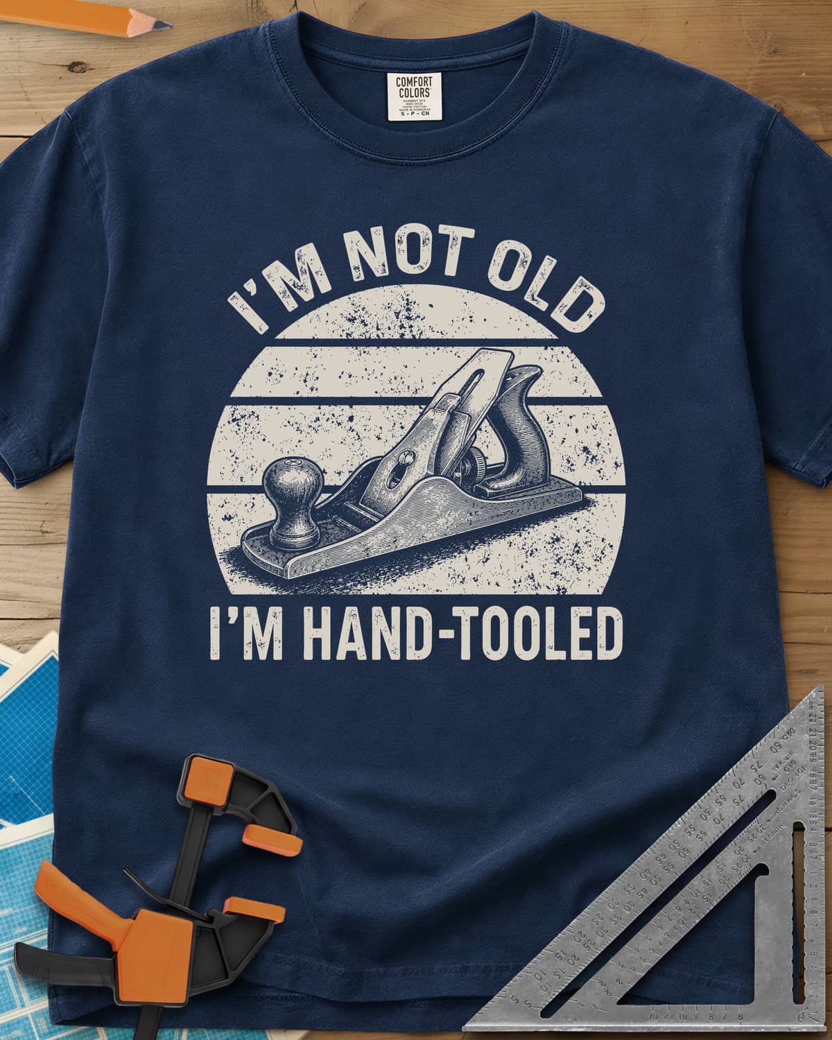 Hand Tooled heavyweight tee in Navy, a bench plane in a retro sunset circle