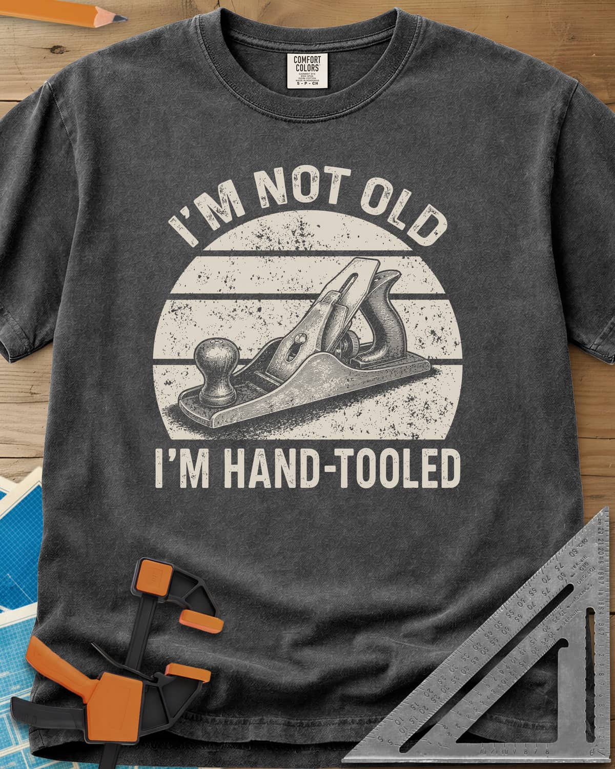 Hand Tooled heavyweight tee in Pepper, a bench plane in a retro sunset circle