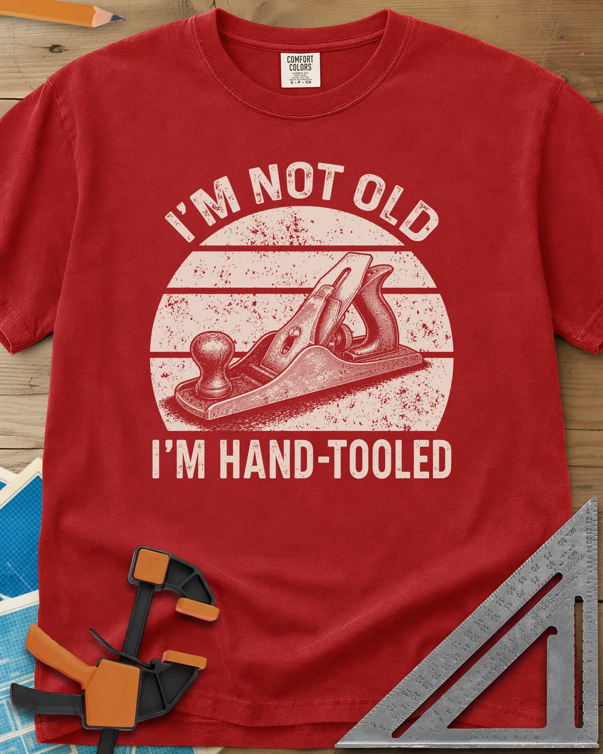 Hand Tooled heavyweight tee in Red, a bench plane in a retro sunset circle