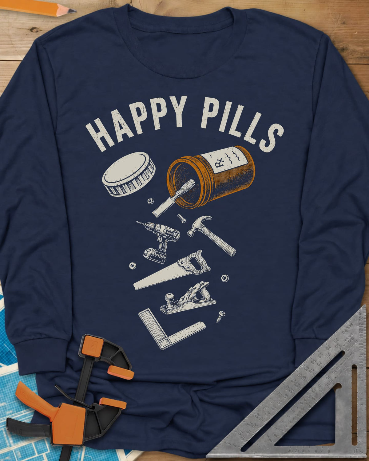 Happy Pills long sleeve shirt in Navy, a tipped pill bottle spilling hand tools and a cordless drill