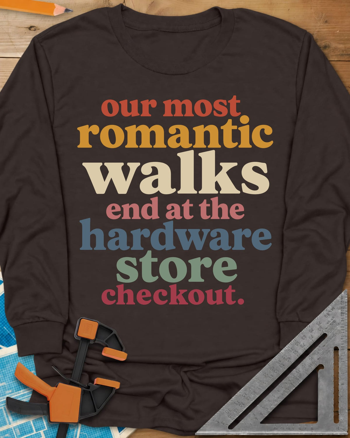 Hardware Store Checkout long sleeve shirt in Dark Chocolate, stacked lowercase type in rust, mustard, cream, pink, blue and