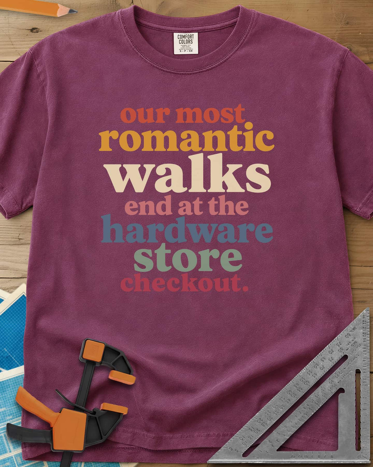 Hardware Store Checkout heavyweight tee in Berry, stacked lowercase type in rust, mustard, cream, pink, blue and sage