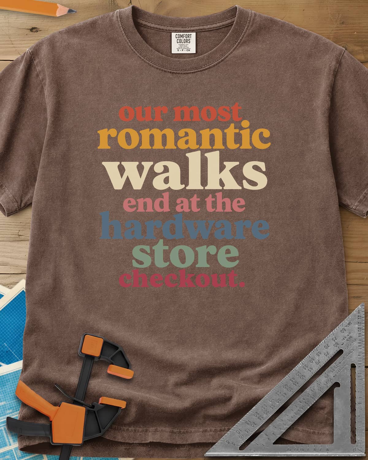 Hardware Store Checkout heavyweight tee in Espresso, stacked lowercase type in rust, mustard, cream, pink, blue and sage