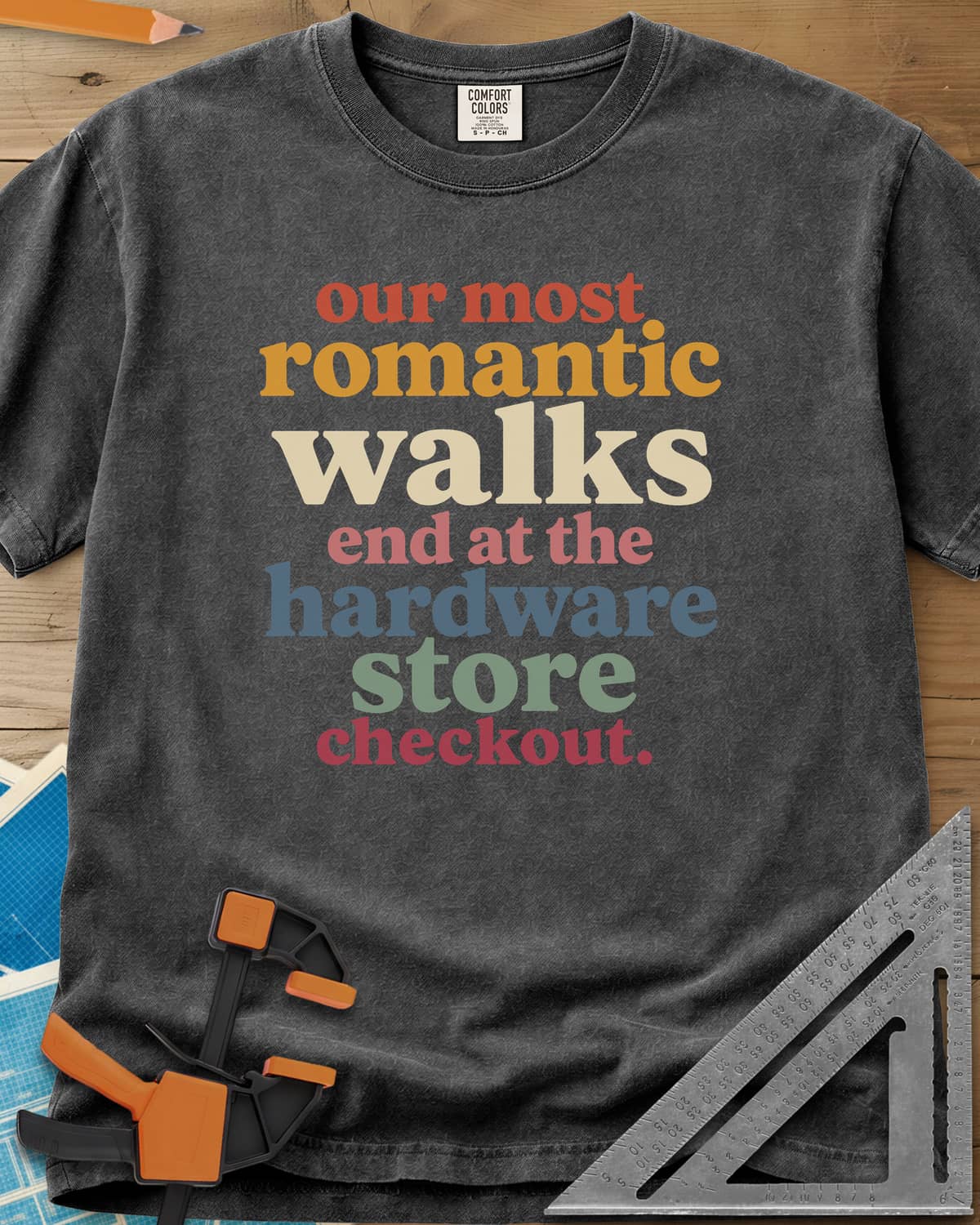Hardware Store Checkout heavyweight tee in Pepper, stacked lowercase type in rust, mustard, cream, pink, blue and sage