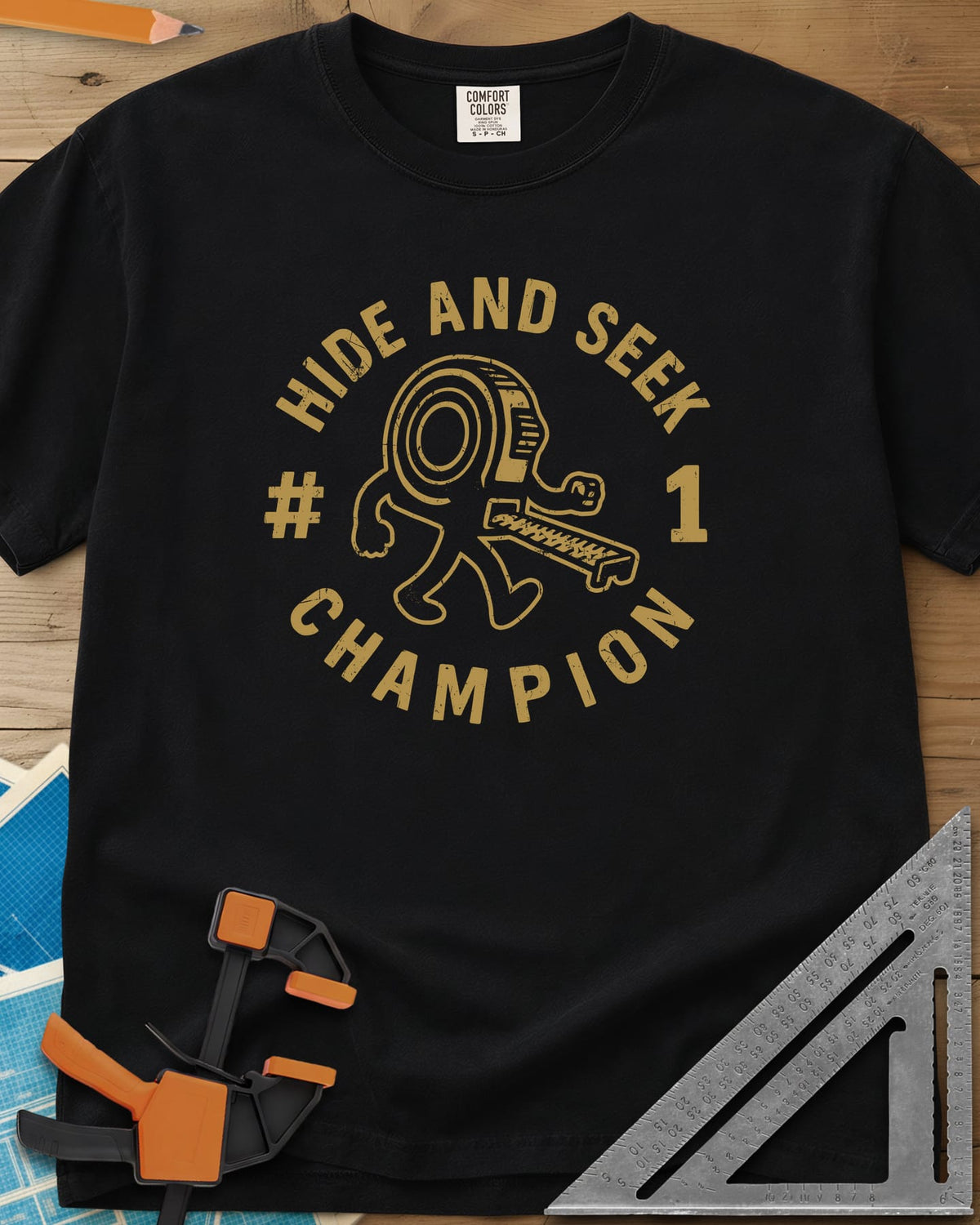 Hide And Seek heavyweight tee in Black, a walking tape measure character inside a round badge