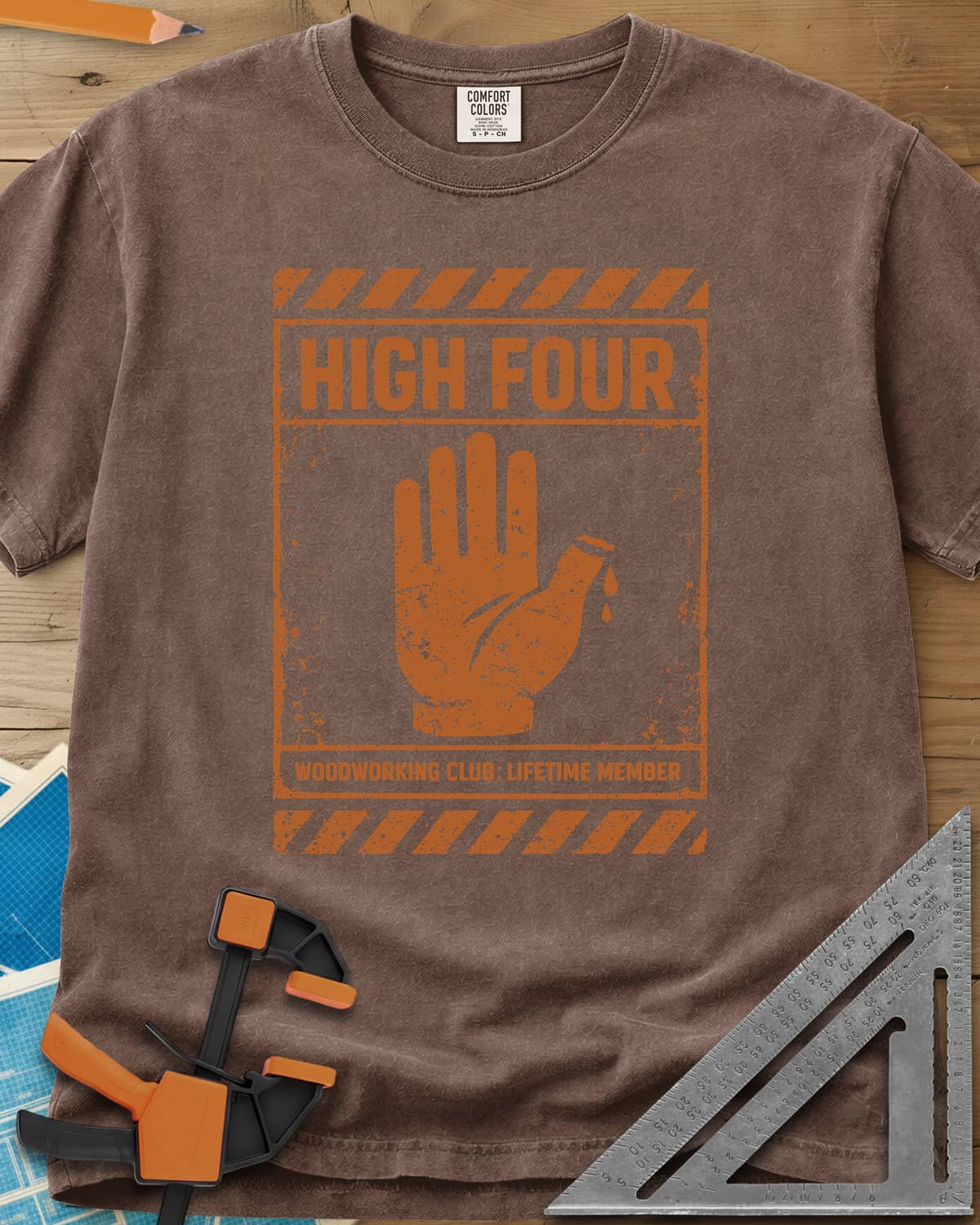 High Four heavyweight tee in Espresso, a raised hand with four fingers and a thumb stump on a hazard sign