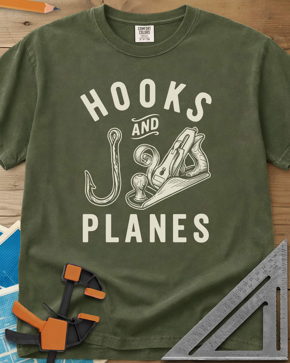 Hooks And Planes heavyweight tee in Hemp, an engraved fish hook and a hand plane with a curl of shavings