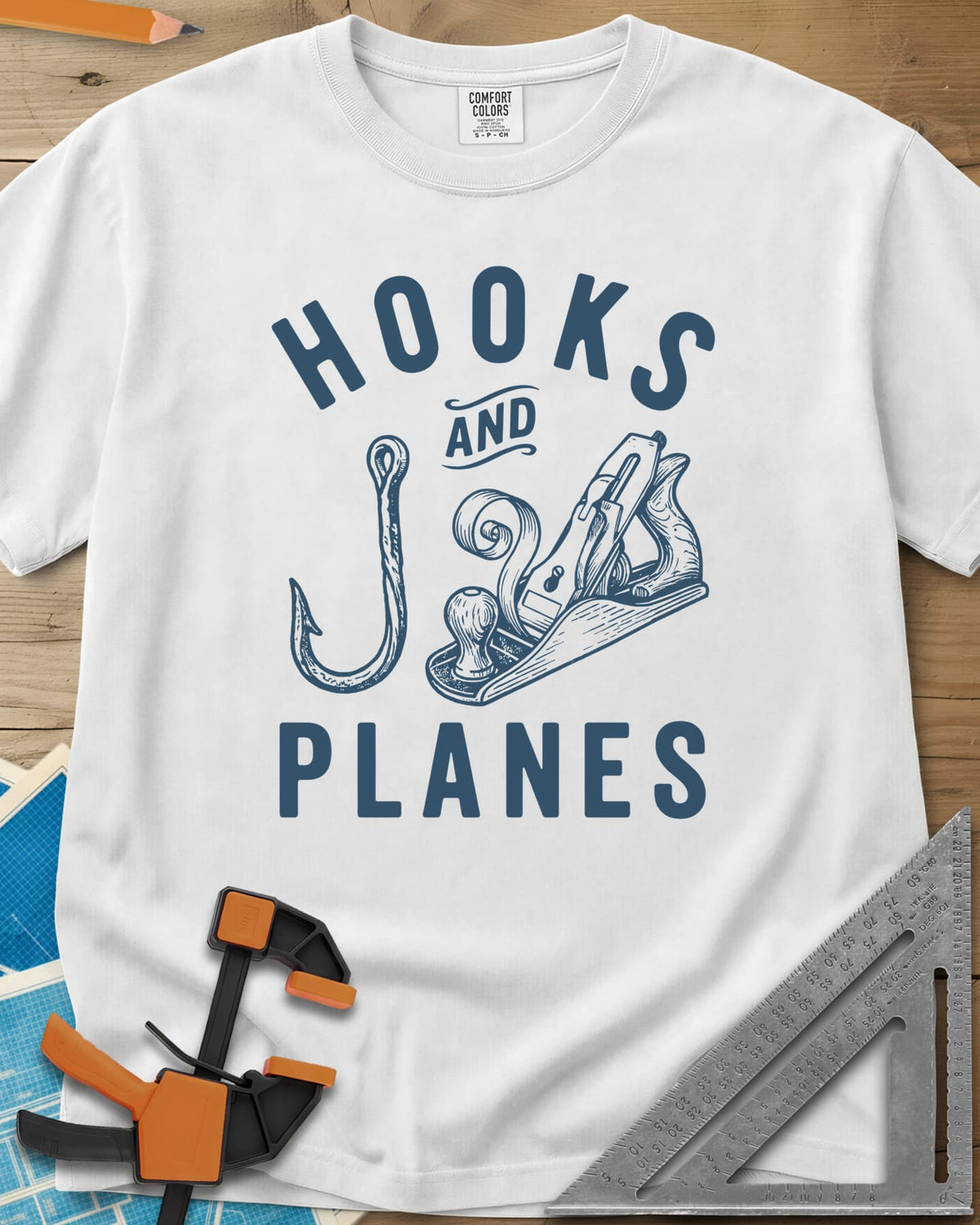 Hooks And Planes heavyweight tee in White, an engraved fish hook and a hand plane with a curl of shavings