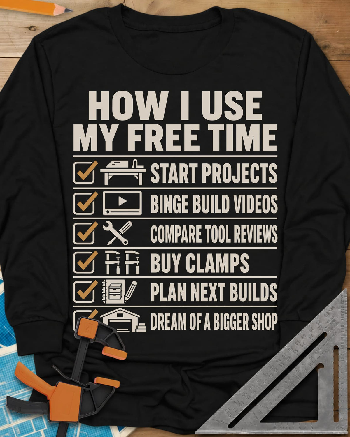 How I Use My Free Time long sleeve shirt in Black, six-line checklist, each tick beside a tiny icon