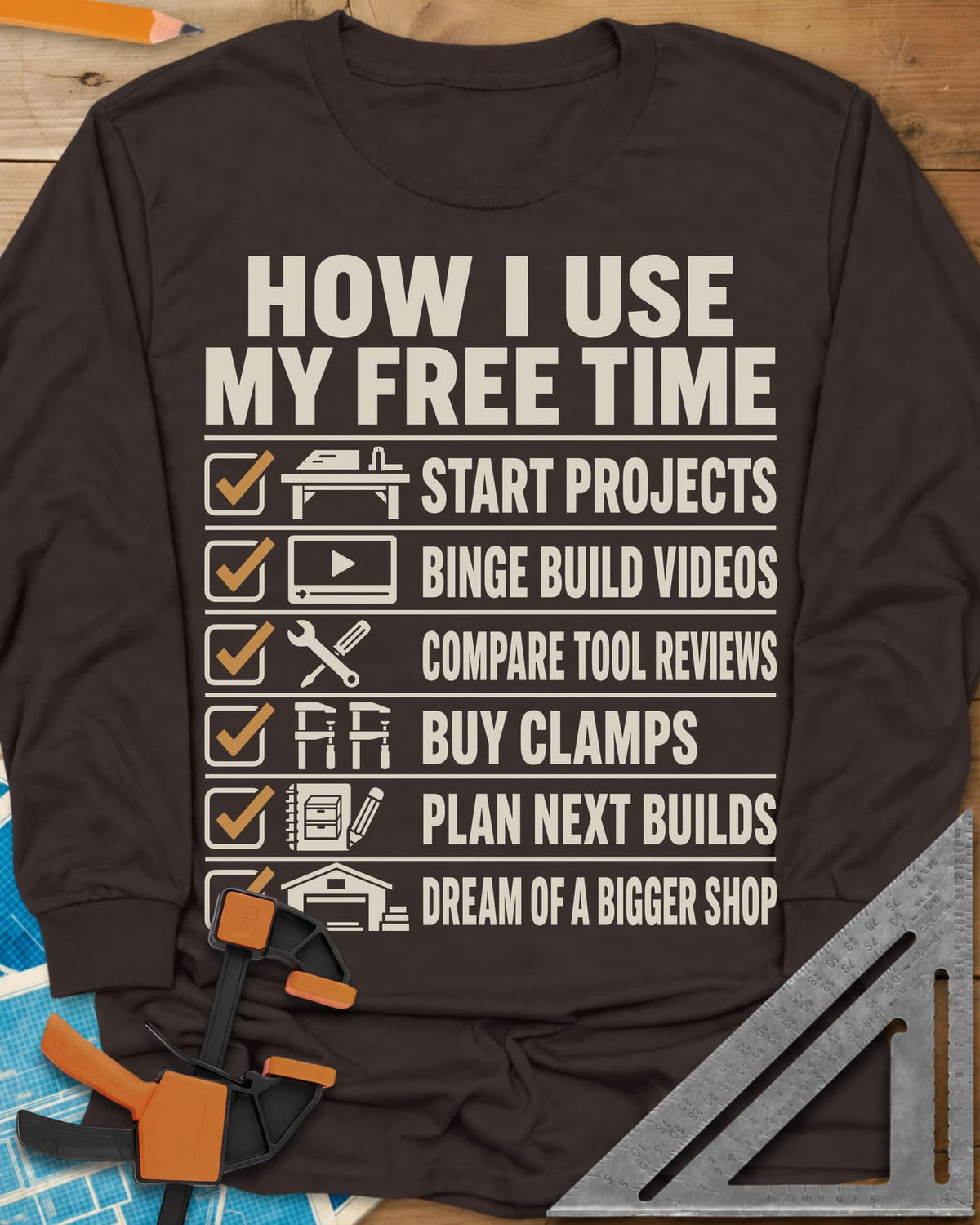 How I Use My Free Time long sleeve shirt in Dark Chocolate, six-line checklist, each tick beside a tiny icon