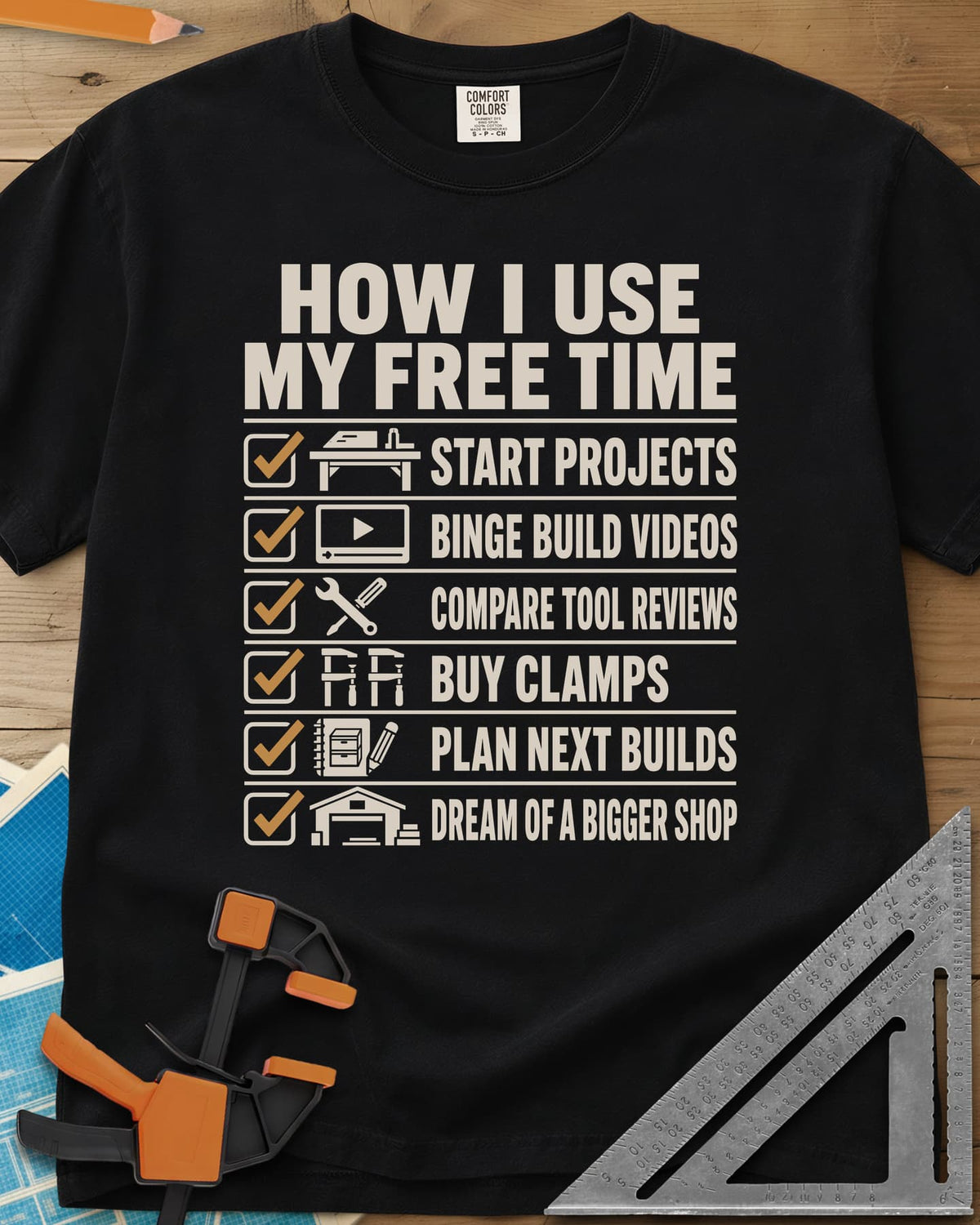 How I Use My Free Time heavyweight tee in Black, six-line checklist, each tick beside a tiny icon