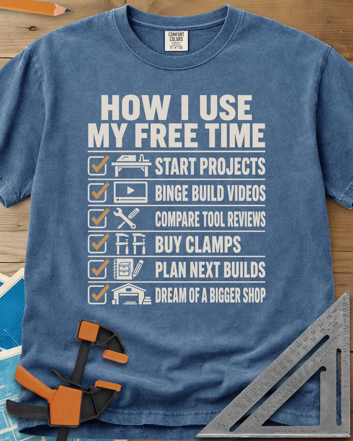 How I Use My Free Time heavyweight tee in Blue Jean, six-line checklist, each tick beside a tiny icon