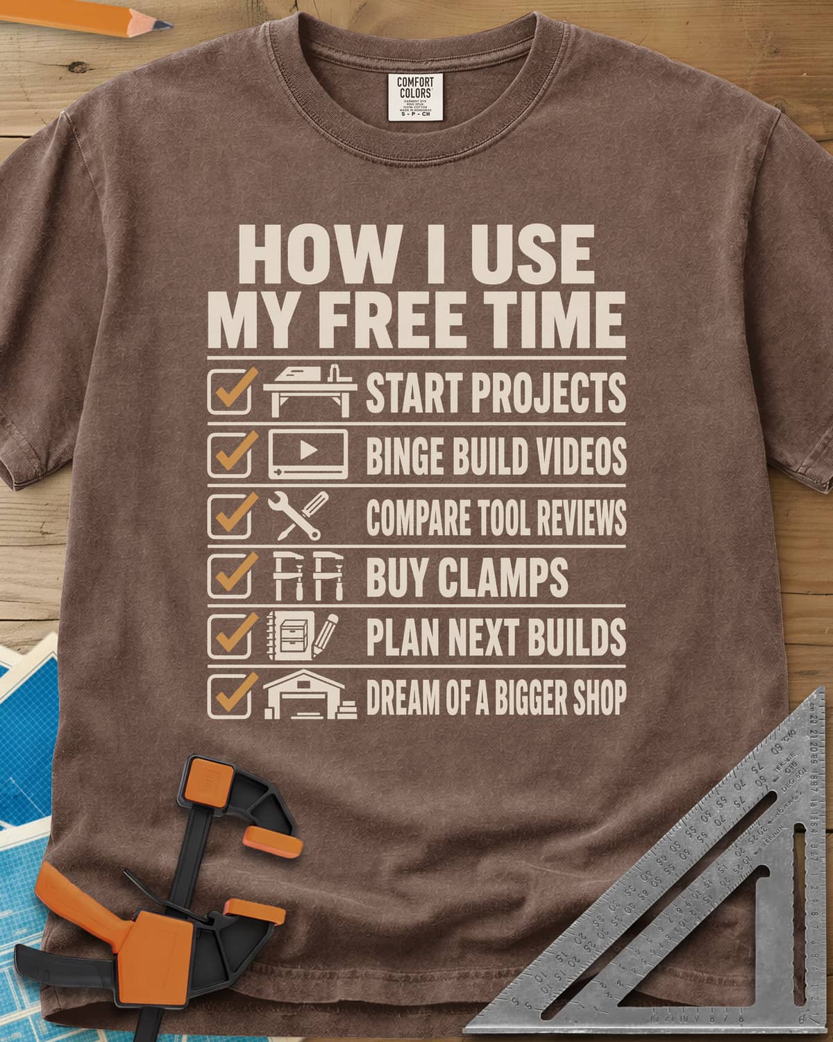 How I Use My Free Time heavyweight tee in Espresso, six-line checklist, each tick beside a tiny icon