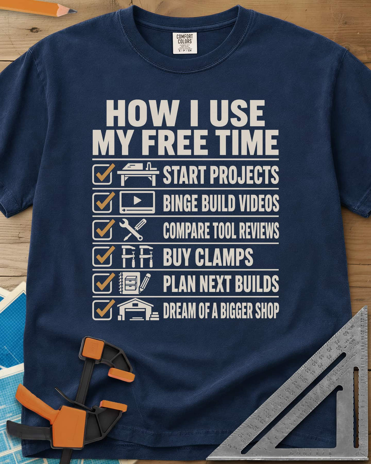 How I Use My Free Time heavyweight tee in Navy, six-line checklist, each tick beside a tiny icon