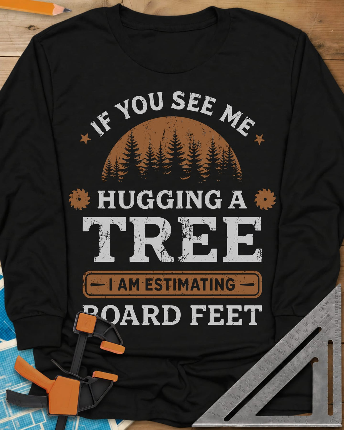 Hugging a Tree long sleeve shirt in Black, a pine forest at sunset with two small saw blades
