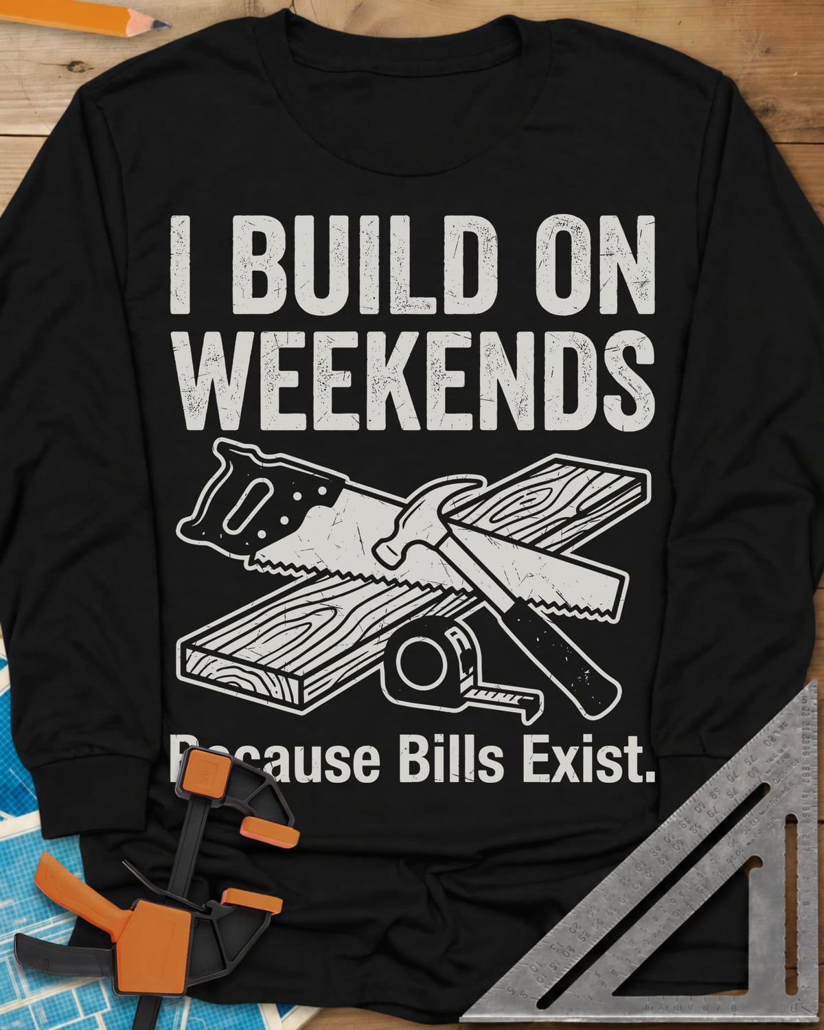 I Build on Weekends long sleeve shirt in Black, crossed hand saw and hammer with a board and tape measure