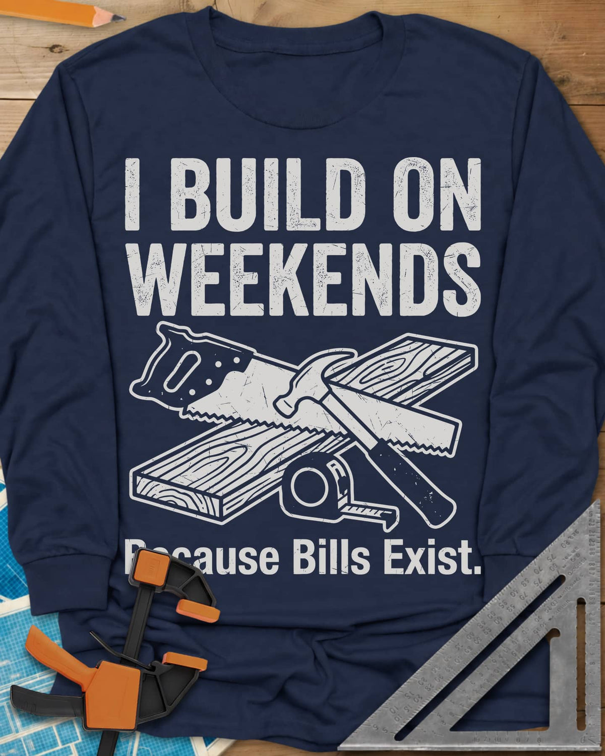I Build on Weekends long sleeve shirt in Navy, crossed hand saw and hammer with a board and tape measure