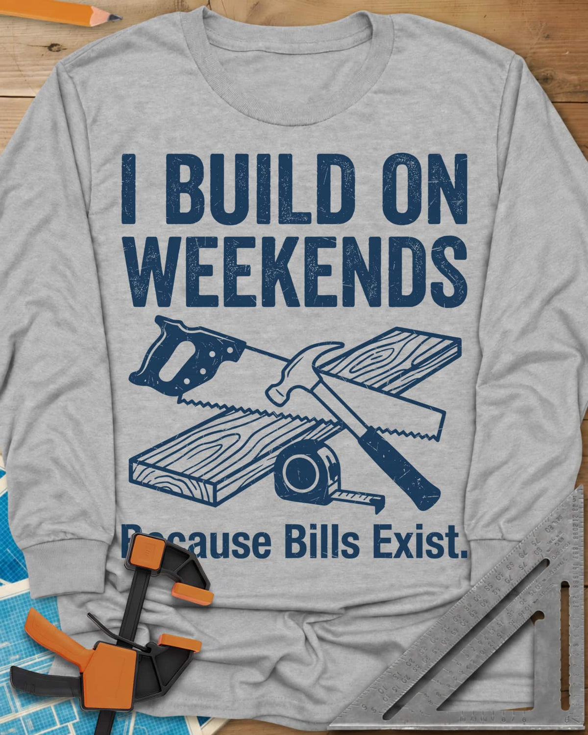 I Build on Weekends long sleeve shirt in Sport Grey, crossed hand saw and hammer with a board and tape measure