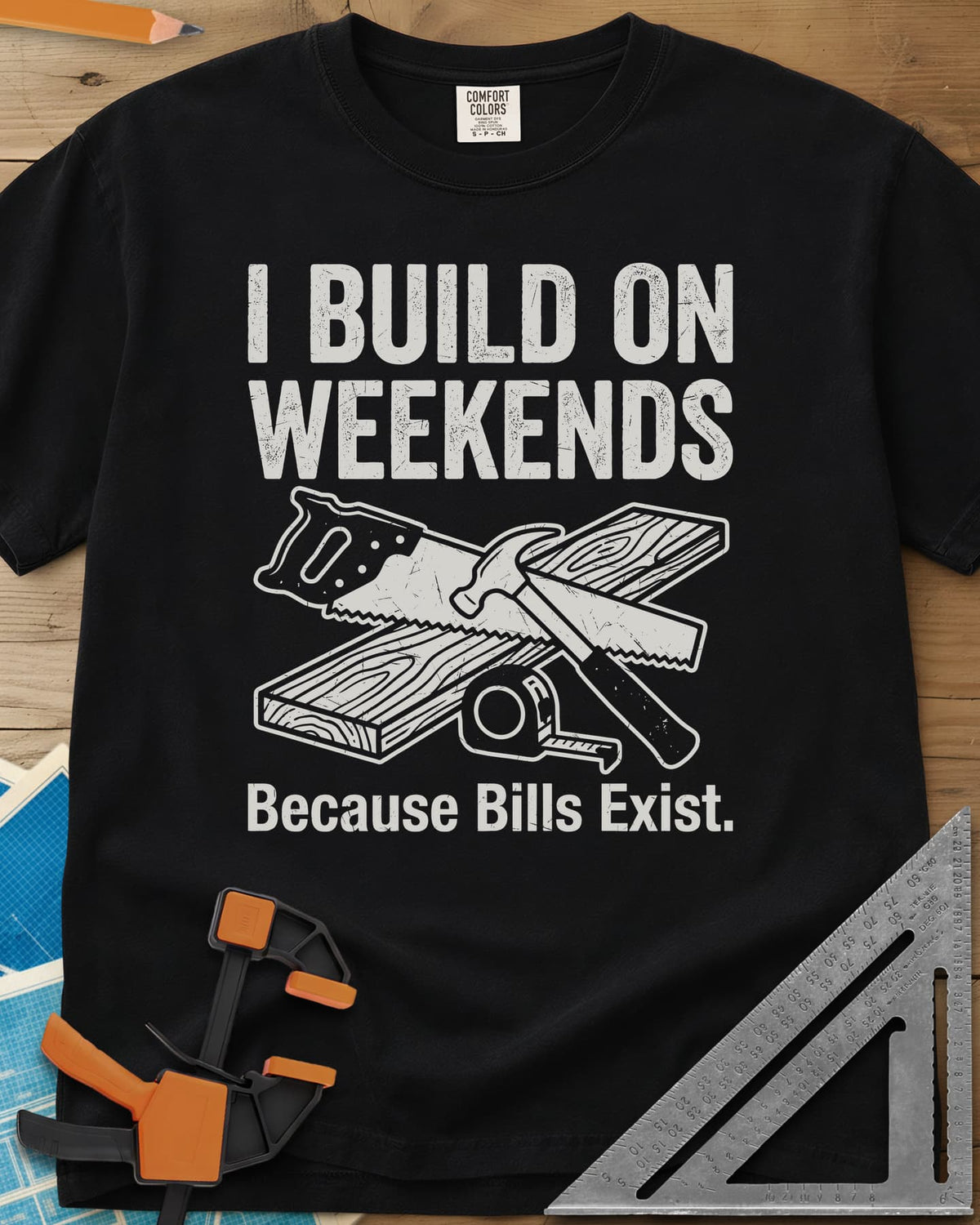 I Build on Weekends heavyweight tee in Black, crossed hand saw and hammer with a board and tape measure