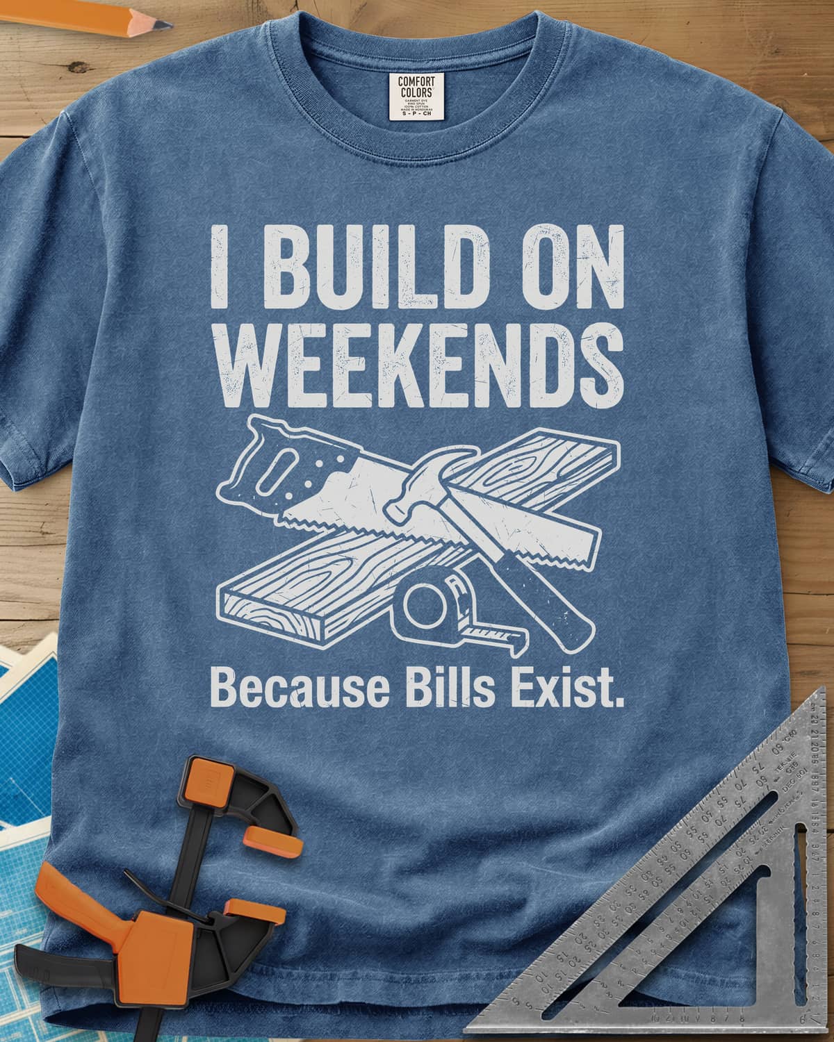 I Build on Weekends heavyweight tee in Blue Jean, crossed hand saw and hammer with a board and tape measure