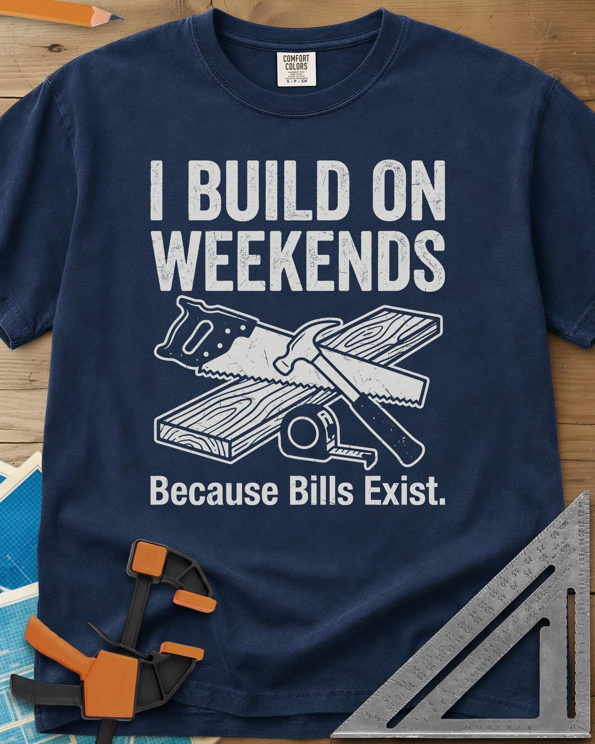 I Build on Weekends heavyweight tee in Navy, crossed hand saw and hammer with a board and tape measure