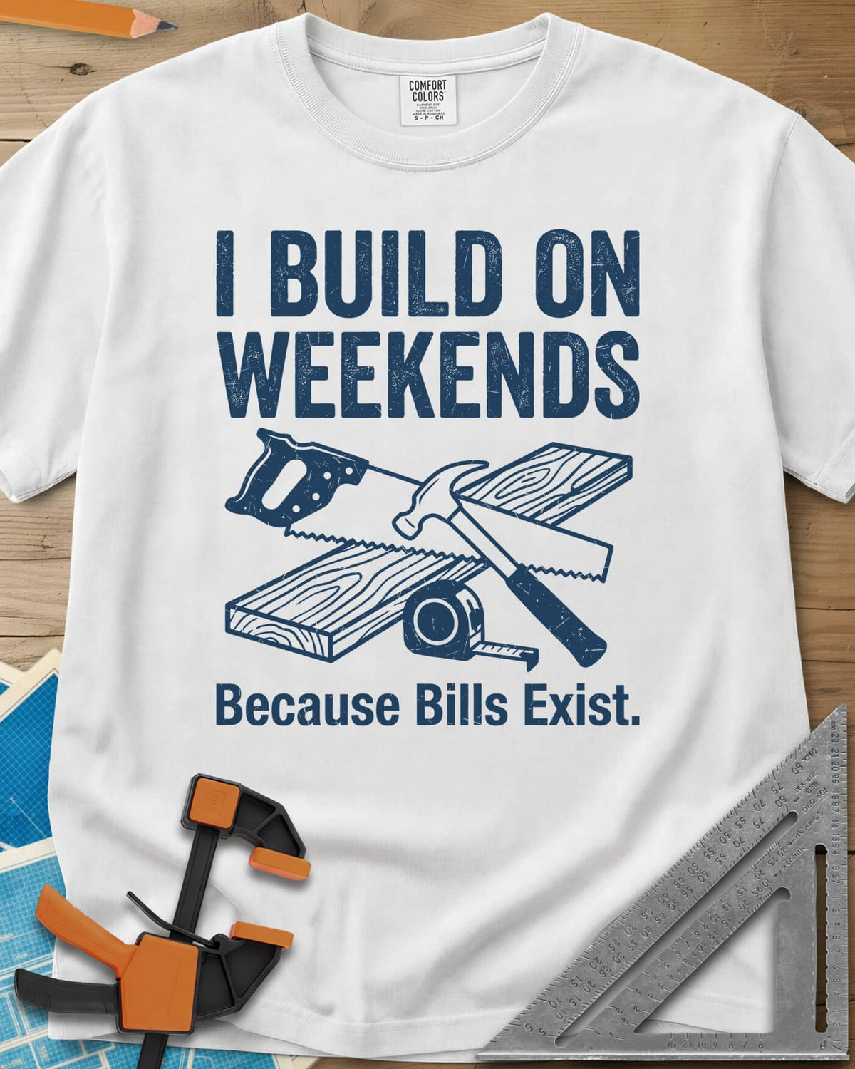 I Build on Weekends heavyweight tee in White, crossed hand saw and hammer with a board and tape measure