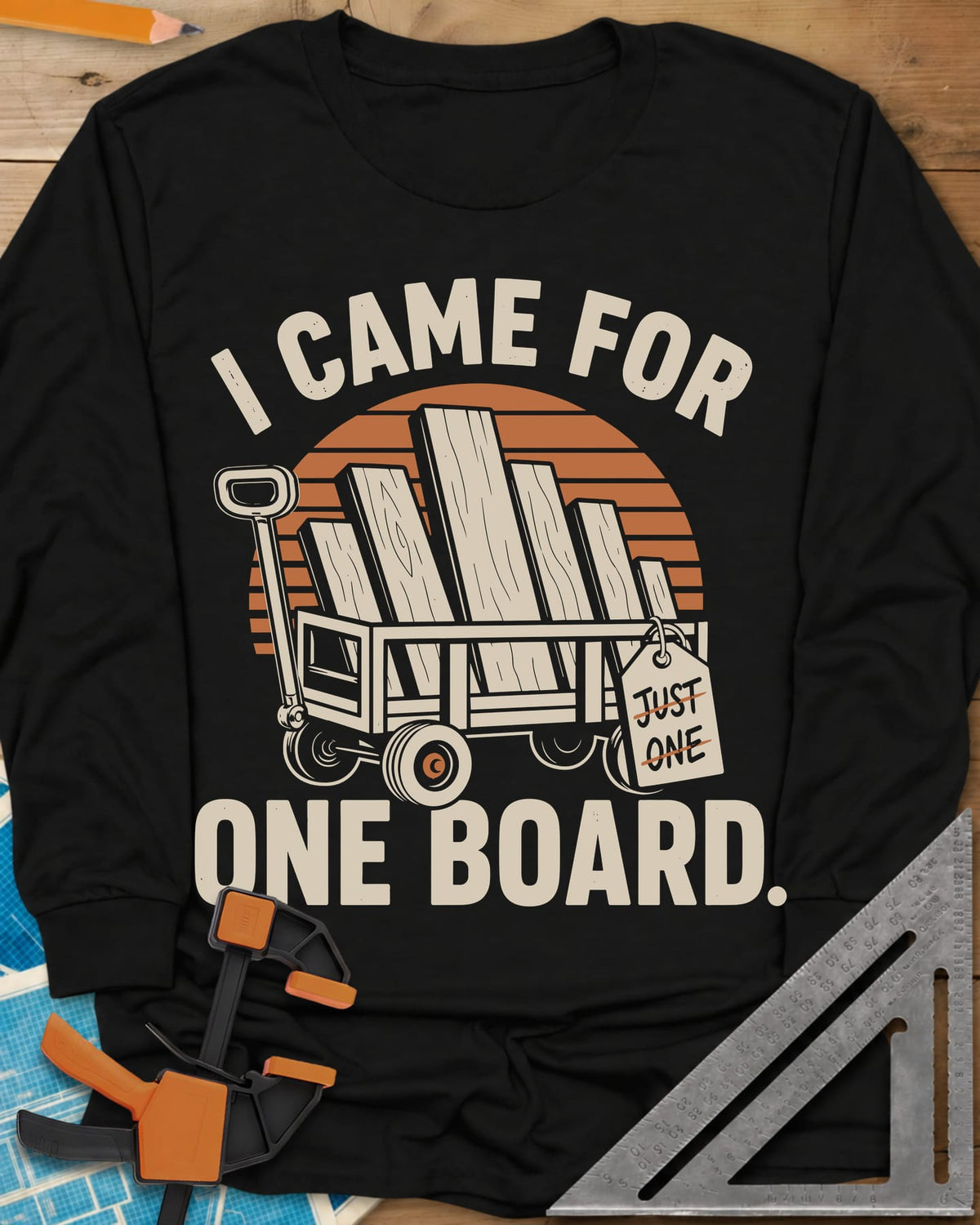 I Came For One Board long sleeve shirt in Black, a wagon stacked with boards and a struck-out JUST ONE tag