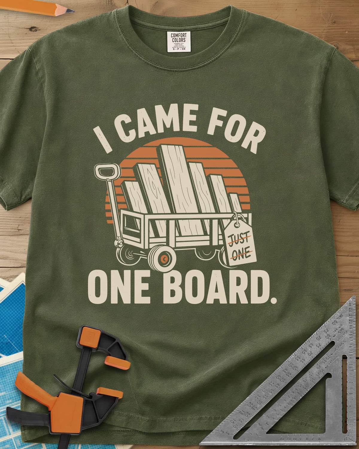 I Came For One Board heavyweight tee in Hemp, a wagon stacked with boards and a struck-out JUST ONE tag