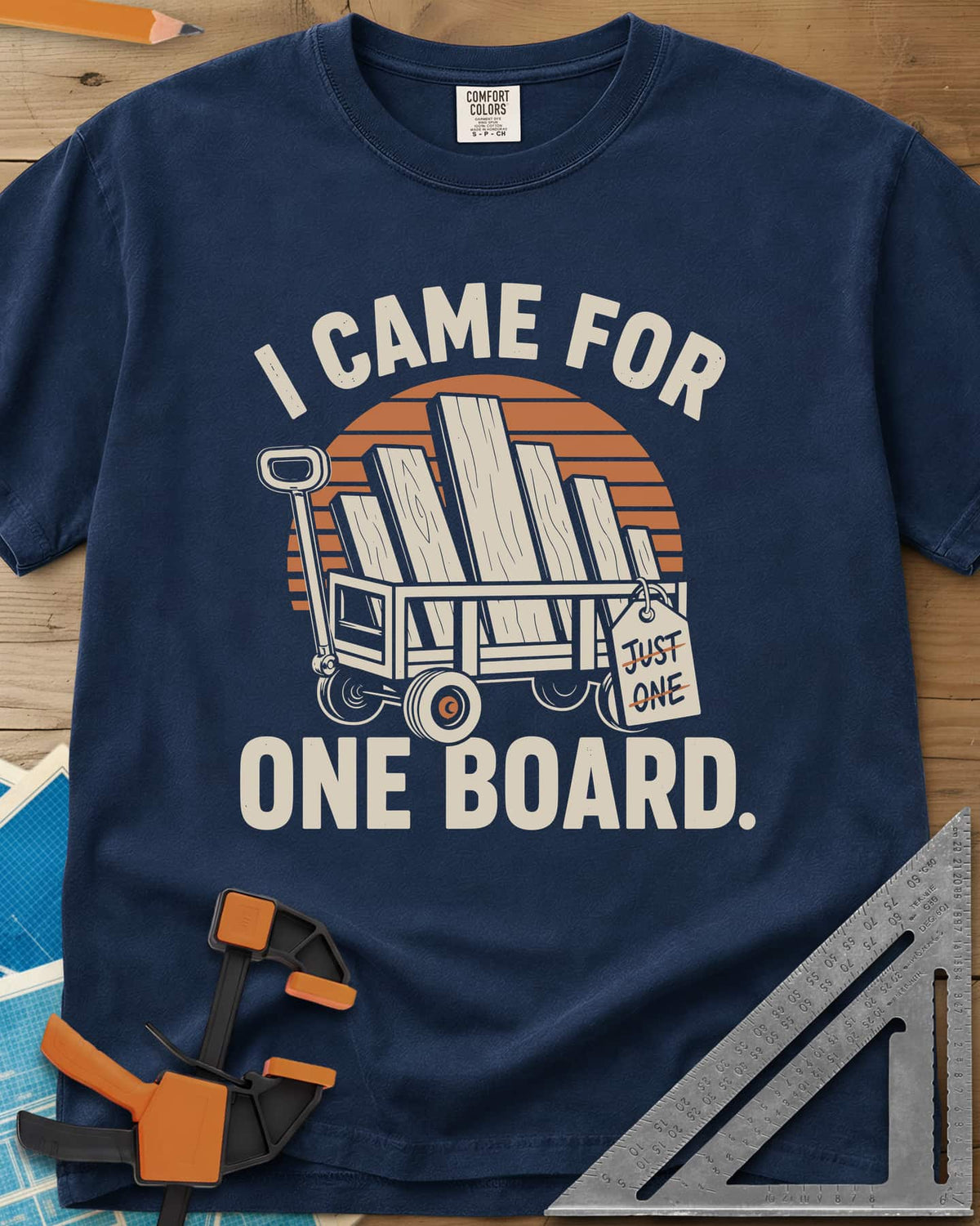 I Came For One Board heavyweight tee in Navy, a wagon stacked with boards and a struck-out JUST ONE tag