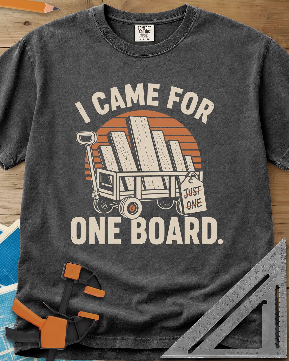 I Came For One Board heavyweight tee in Pepper, a wagon stacked with boards and a struck-out JUST ONE tag