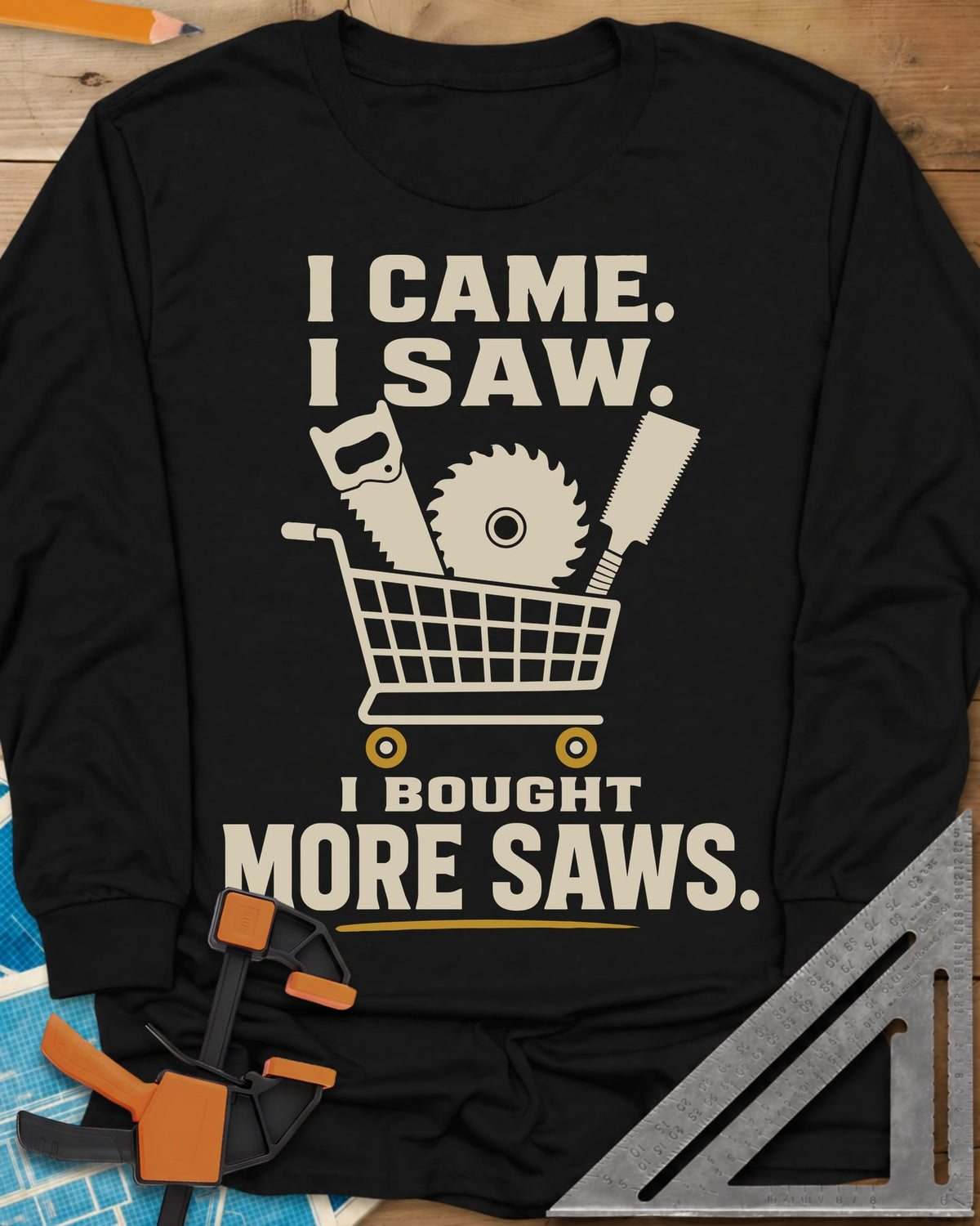 I Came I Saw I Bought More Saws long sleeve shirt in Black, a shopping cart holding a handsaw, a saw blade and a pull saw