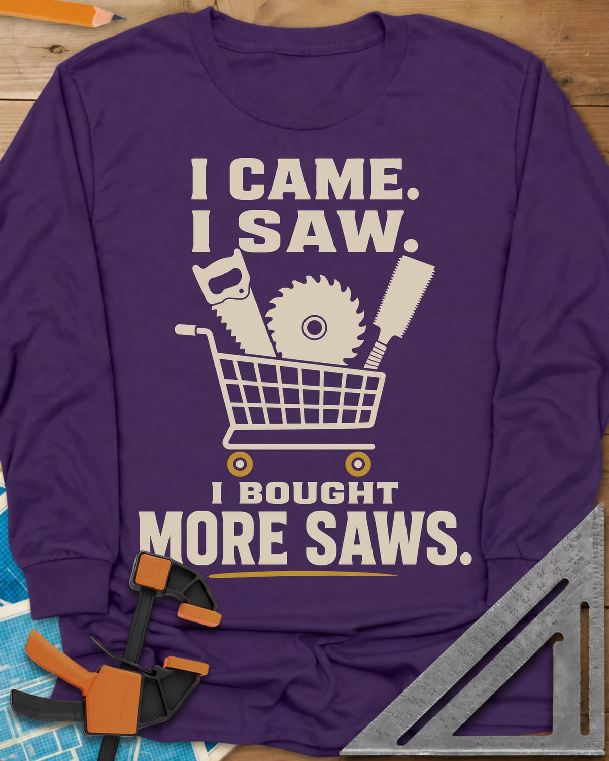 I Came I Saw I Bought More Saws long sleeve shirt in Purple, a shopping cart holding a handsaw, a saw blade and a pull saw