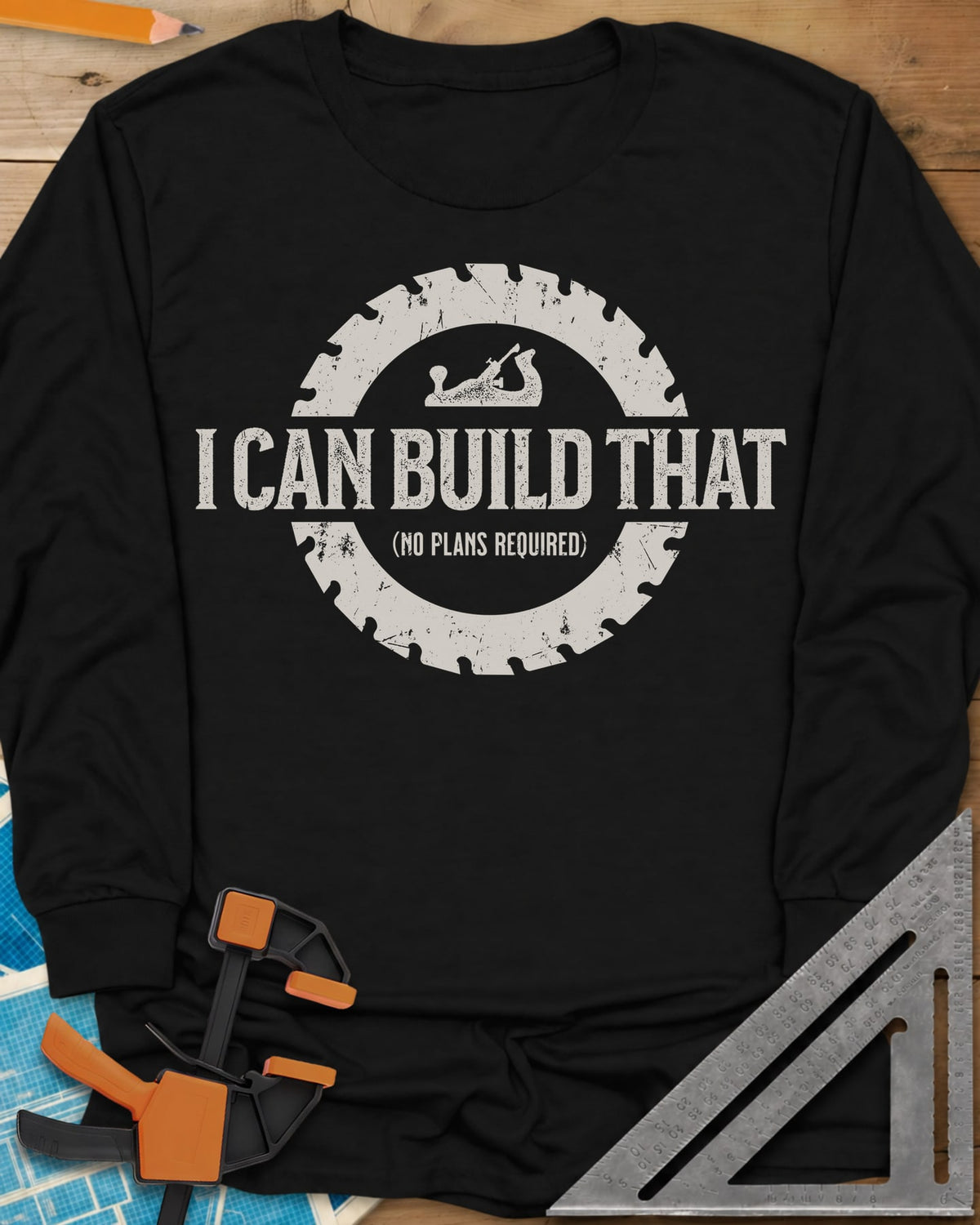 I Can Build That long sleeve shirt in Black, distressed lettering in a saw blade ring with a small hand plane