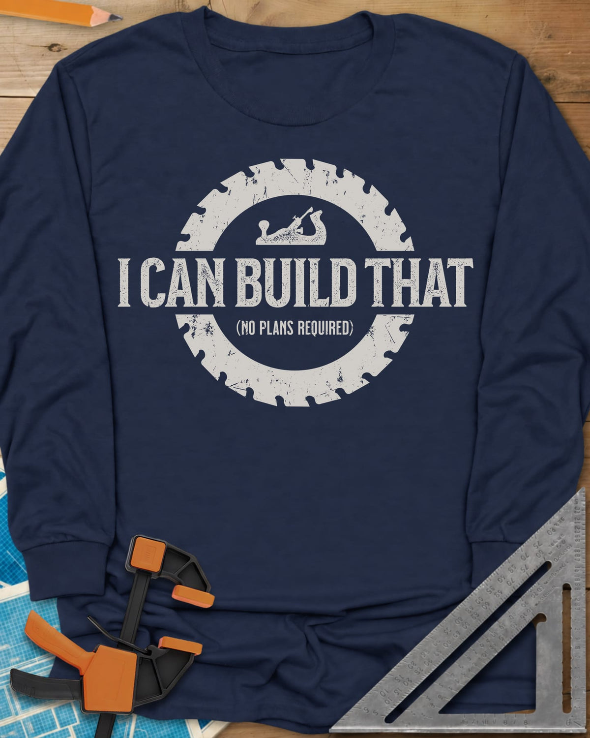 I Can Build That long sleeve shirt in Navy, distressed lettering in a saw blade ring with a small hand plane