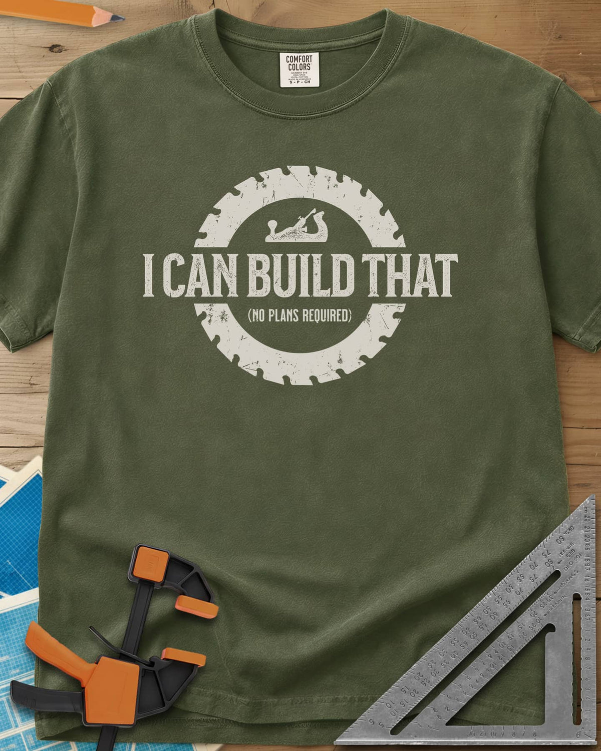 I Can Build That heavyweight tee in Hemp, distressed lettering in a saw blade ring with a small hand plane