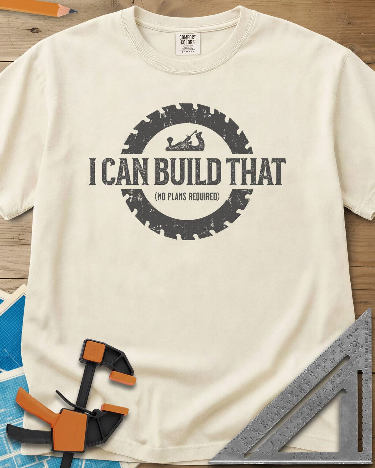 I Can Build That heavyweight tee in Ivory, distressed lettering in a saw blade ring with a small hand plane