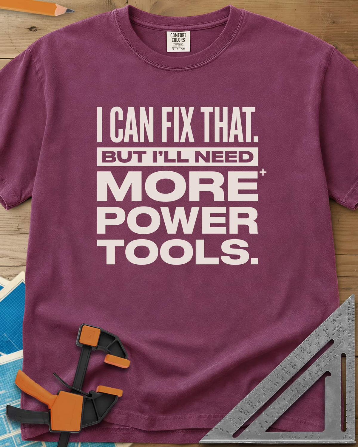 I Can Fix That heavyweight tee in Berry, stacked bold lettering with one line reversed out of a bar