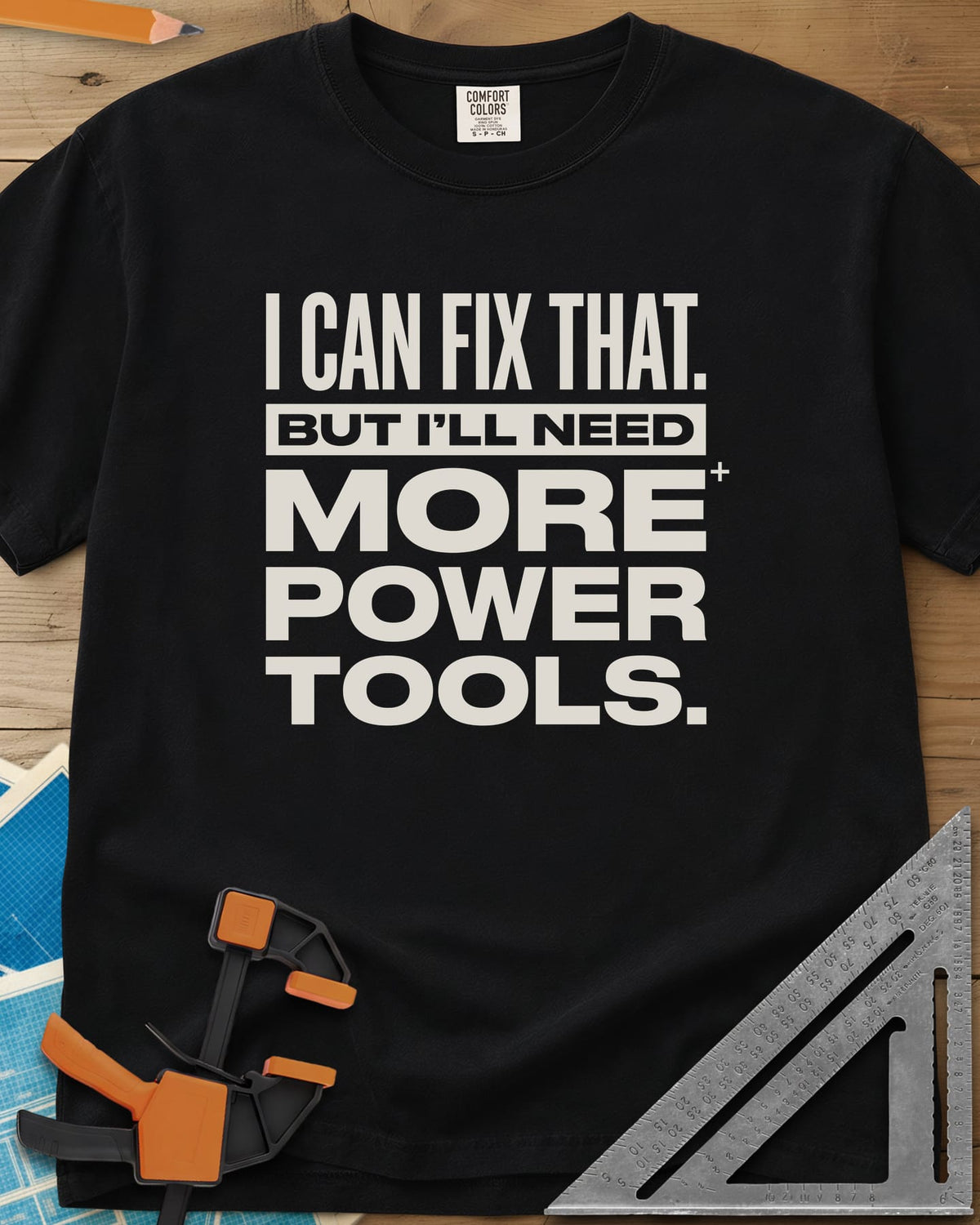 I Can Fix That heavyweight tee in Black, stacked bold lettering with one line reversed out of a bar