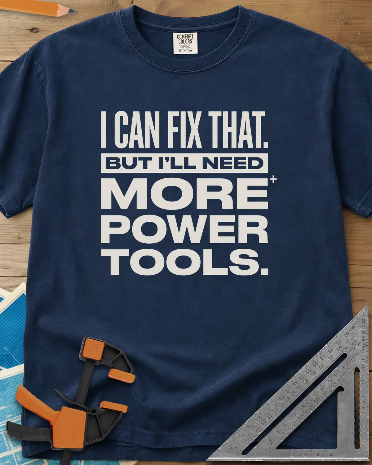 I Can Fix That heavyweight tee in Navy, stacked bold lettering with one line reversed out of a bar